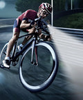 Cyclist using Beefed-Up 2400 Lumen Bicycle Headlight with 10000mAh Battery Pack on road at night
