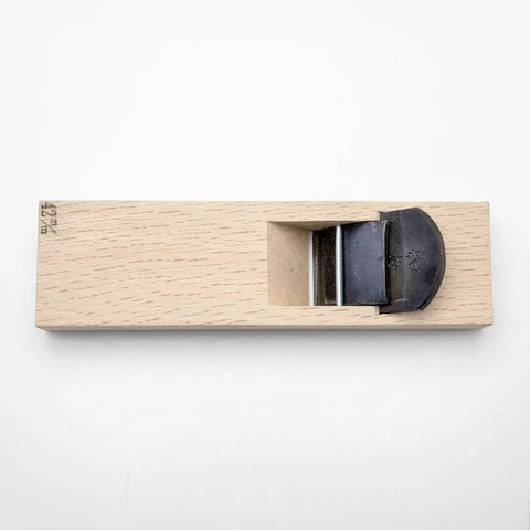 Japanese Kanna Manual Hand Plane For Smoothing Woodwork Precision Ground 42 Millimeter Steel Blade top view with wooden body and blade