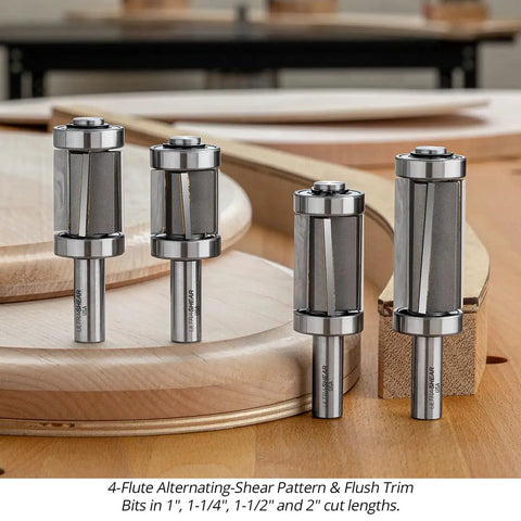 Badass Four Piece Router Bit Set With Alternating Shear Geometry For No Sweat Pattern And Flush Trim Cutting heavy duty carbide bits in various sizes on wood surface.