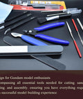 Gundam Model Tool Kit 28pcs Adult Hobby Tools Set with pliers, files, and tweezers on a black surface for precise crafting.