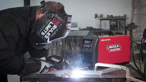 Welder using No Rules No Limits Auto Darkening Welding Helmet With Grind Mode And Shade 7 To 13 Lightweight Headgear in workshop