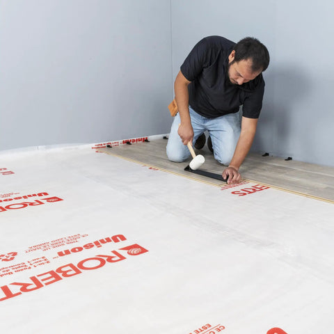 Installer using Maverick Wide Angle Pull Bar for Vinyl Laminate and Wood Flooring Installations Triangular Head Absorbs 10x Strike Force