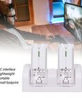 Gamer using 4 In 1 Remote Charging Dock With Built In 2800mAh Batteries, Portable ABS Base In White, dual slots visible