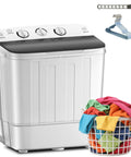 Portable Twin Tub Washing Machine With Drying Rack And Ten Hangers, 12 Lb Washer Plus 7 Lb Spinner, Semi Automatic Compact Laundry Setup next to colorful laundry basket.
