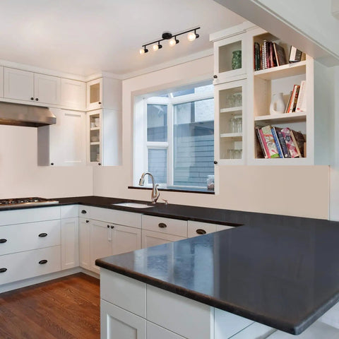 4 Light Track Bar Lighting With Glass Heads In Cool Matte Black Finish in modern kitchen ceiling, adjustable heads shown
