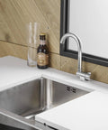 Premium RV Sink Faucet with Spotless Chrome Finish Heavy Duty 360 Swivel Marine Cold Water Tap Compact Deck Mount Setup for Camper Van Yacht and Weekend Road Trips beside a stainless steel sink.