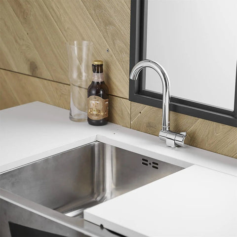 Premium RV Sink Faucet with Spotless Chrome Finish Heavy Duty 360 Swivel Marine Cold Water Tap Compact Deck Mount Setup for Camper Van Yacht and Weekend Road Trips beside a stainless steel sink.