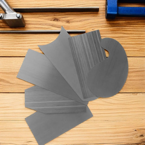 Tough As Nails Steel Cabinet Scraper Tool Kit With Two Precision Card Scrapers For Woodworking, showing five steel scrapers on wooden surface.