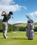 Golfer on course with 15 Way Top Divider Golf Cart Bag With Full Length Dividers Rain Hood Grip Locking Bottom 600D Polyester.