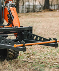 Skid Steer Sod Roller with Adjustable 36in 44in 52in Widths, Universal Quick Tach, shown attached to skid steer in grassy field