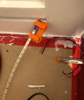 Magnetic Soldering Jig With Nano Suction Base For LED Strip Wiring used in a wiring project, showcasing hands-free operation.