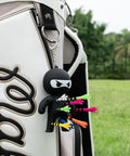 Ninja Golf Tee Holder Keychain Portable Tee Organizer For Golf Bags Includes 10 Colorful Tees A Dope Gift For Men And Women Black On The Course Accessory attached to golf bag.