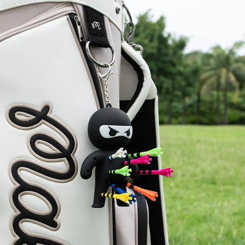 Ninja Golf Tee Holder Keychain Portable Tee Organizer For Golf Bags Includes 10 Colorful Tees A Dope Gift For Men And Women Black On The Course Accessory attached to golf bag.