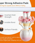 Super Grippy Removable Glue Dots For Diy Crafts And Home Decor Total Game Changer Formula holding decorative figure upside down.