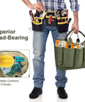 Man holding Heavy Duty Canvas Garden Tool Bag with eight pockets, showcasing tools and gear for indoor outdoor gardening and yard work.