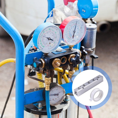 Close-up of a blue air compressor with gauges and a 5 Way 7 Port Aluminum Pneumatic Manifold Air Distribution Block with accessory tape.
