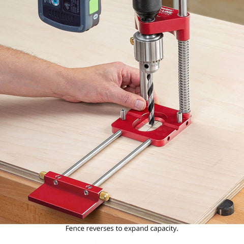 Auto Line Drill Guide Portable Drill Guide for Perpendicular Holes Up to Two Inches with Laser Centerlines in use on wood