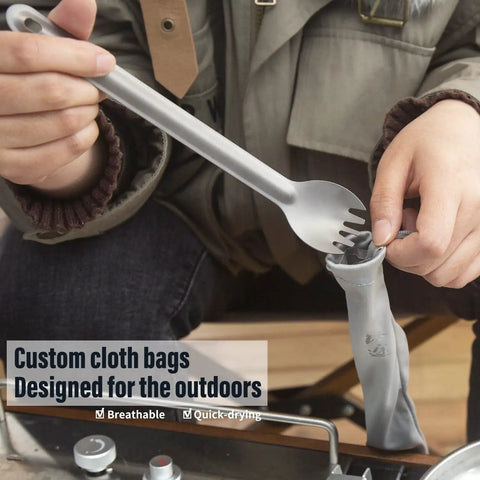 Person using Ultra Lightweight Titanium Long Handle Spork And Spoon Set For Outdoor Camping And Backpacking with quick-dry bag