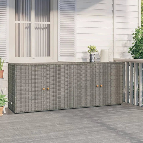 Heavy Duty Grey Garden Storage Cabinet And Outdoor Tool Chest, Weather Resistant Patio Organizer With Pe Rattan And Powder Coated Steel Frame, Tough As Nails Backyard Stash Box With Acacia Wood Knobs For Deck Use on a patio.
