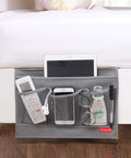 Slide Under Mattress Bedside Storage Caddy With Sturdy Oxford Cloth And Leather Trim offers three mesh pockets with phone, remote, and tablet.