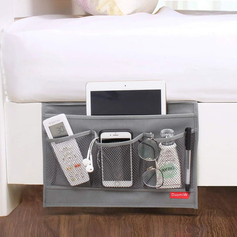 Slide Under Mattress Bedside Storage Caddy With Sturdy Oxford Cloth And Leather Trim offers three mesh pockets with phone, remote, and tablet.