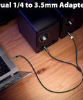 Three Point Five Millimeter To Dual One Quarter Inch TS Stereo Audio Cable With Gold Plated Braided Adapter Cable, in use with speakers