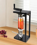 Top Shelf Manual Jar Sealer For 55Mm Soda Pots With Heavy Steel Build And Smooth Rotary Winder That Knocks Out Leaks And Keeps Your Brew Fresh As A Whistle with a glass jar and cherries on a wooden table.