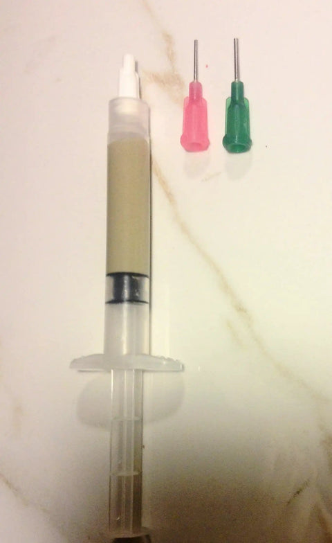 Silver Solder Paste With Flux One Quarter Oz Syringe Lead Free Cadmium Free Low Temp Solder At 430F Built In Flux For Jewelry Making Electronics Repair And Metal Craft Made In USA next to two colored syringe tips