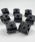 Oil King V2 Pre-Lubed Black Linear Keyboard Switches Pack Of 10 showing top and bottom views for smooth keystrokes