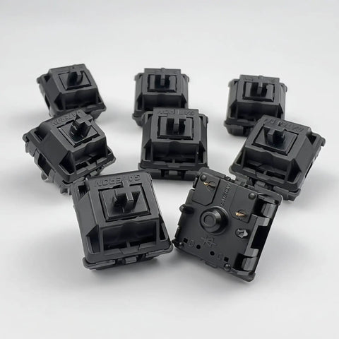Oil King V2 Pre-Lubed Black Linear Keyboard Switches Pack Of 10 showing top and bottom views for smooth keystrokes