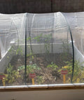 See Through Garden Netting 8.2 By 16.4 Feet Bug And Bird Barrier Netting for plants in raised planter box, installed view