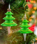 Kick Start Your Festive Craft Game With This 20 Piece Diy Christmas Tree Ornament Woodturning Kit Featuring Smooth Multicolored Wooden Tubes That Are A Straight Up Game Changer For Making Hella Awesome Xmas Decor And Tree Hangings - Green glass tree ornaments hanging on pine.