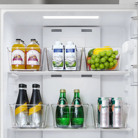 Open fridge with 12 Pack Clear Plastic Storage Bins With Labels For Home, Kitchen, Pantry, Bathroom, Office And Cabinets, filled with drinks and fruits