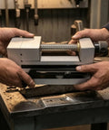 Precision Swivel Vise Machine Workholding Clamp With Graduated Rotation And Secure Jaw For Accurate Fixturing Perfect For CNC Milling Grinding Shop Operations 3 Inch Size held securely by two hands on a workbench.