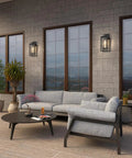 14 Inch Double Cage Outdoor Wall Lights 2 Pack Exterior Porch Lantern Sconces on a modern patio with grey furniture.