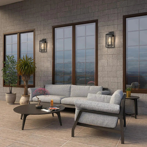 14 Inch Double Cage Outdoor Wall Lights 2 Pack Exterior Porch Lantern Sconces on a modern patio with grey furniture.