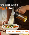 Game Changing Glass Olive Oil Sprayer For Cooking, 16 Oz dual pump dispenser bottle spraying fine mist on salad.