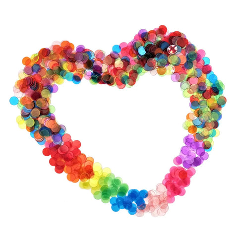 1000 Transparent 3/4 Inch Bingo Counting Chips In Eight Color Set arranged in a heart shape for games and activities.