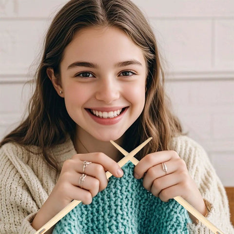 Woman holding large wooden bamboo yarn needles for knitting, showcasing Three Different Sized Nalbinding Needle Set For Knitting And Crochet.
