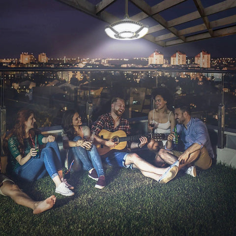 2 Pack Solar Shed Lights With Motion Sensor illuminating group on rooftop at night