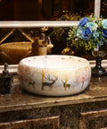 USZWBY Vessel Sinks Bathroom Vessel Sink Nordic Round Ceramic Washbasin Forest Art Countertop Basin with deer design on countertop.