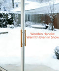 Natural Solid Wood Sliding Patio Door Handle With Ergonomic Curved Grip shown on snowy day glass door with chrome brackets