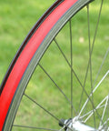 Red 26 Inch Bicycle Rim Tape 4 Pack Elastic PVC Nylon Rim Strips Protect Inner Tube From Spoke Holes And Sharp Edges High Pressure Puncture Resistant Wheel Liner For Mountain And Road Bikes shown installed on wheel