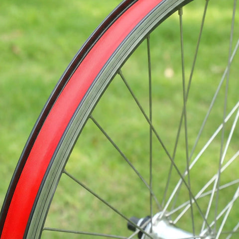 Red 26 Inch Bicycle Rim Tape 4 Pack Elastic PVC Nylon Rim Strips Protect Inner Tube From Spoke Holes And Sharp Edges High Pressure Puncture Resistant Wheel Liner For Mountain And Road Bikes shown installed on wheel