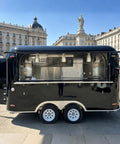 Slick 12 Foot Black Stainless Steel Commercial Food Trailer Equipped With Turnkey Mobile Beer Bar Station And Tough Catering Gear For A No Fuss Pop Up Hustle showing exterior with open service window.