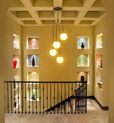 Dope Mid Century Modern Pendant Lighting Four Light Globe Chandeliers With White Opal Glass Shades And Brass Finish illuminating stairwell