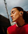 Person wearing QuietComfort Ultra Earbuds 2nd Gen Dope Wireless Noise Canceling With Built In Microphone Immersive Audio USB C Charging