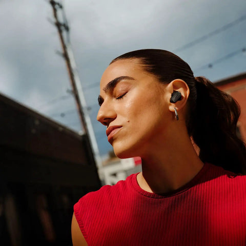 Person wearing QuietComfort Ultra Earbuds 2nd Gen Dope Wireless Noise Canceling With Built In Microphone Immersive Audio USB C Charging
