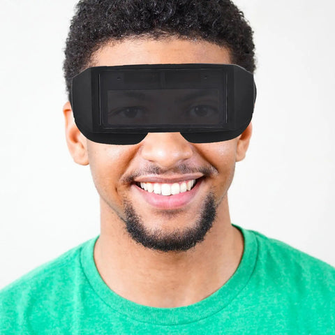 Badass Auto Darkening Welding Goggles Featuring Kickin Wraparound Coverage And Legit Precision Lenses For Ultimate Electric Arc Eye Protection Gear worn by smiling man in green shirt.