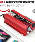 Red 1000W Car Power Inverter with LCD Display and dual AC outlets on white table, connected to a laptop and tablet